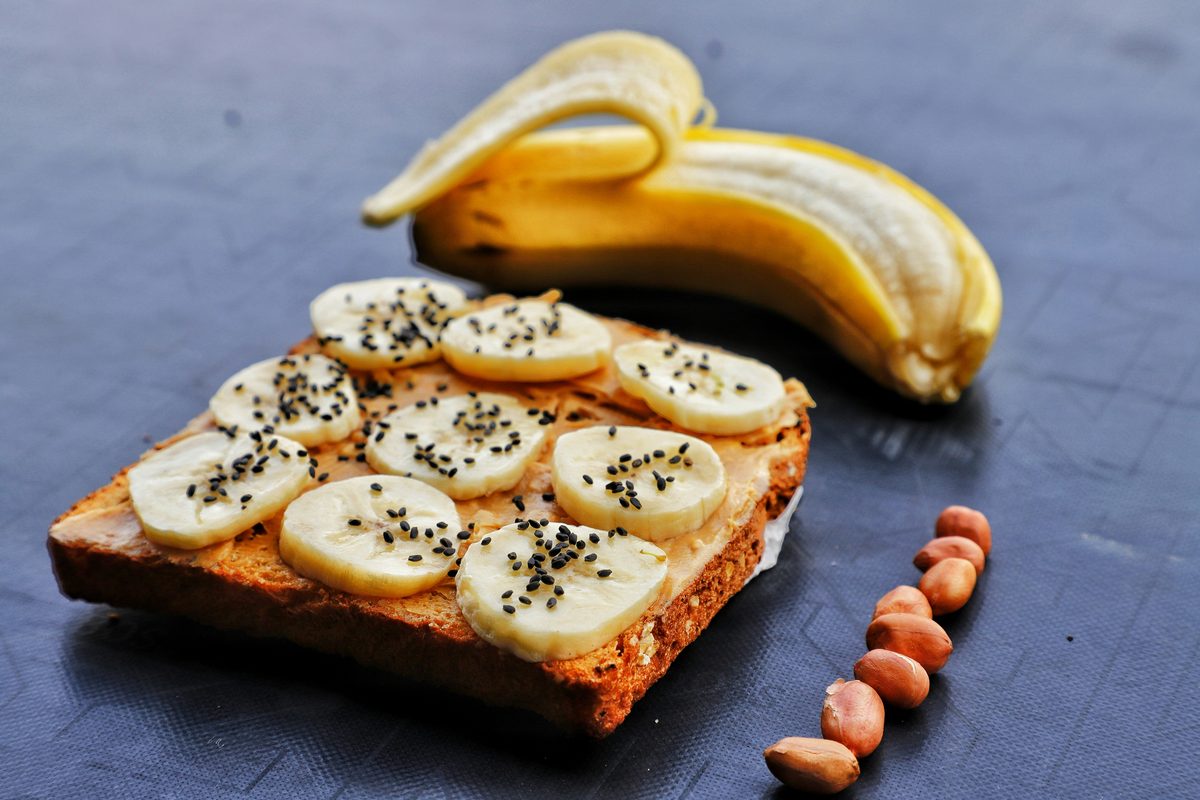 Banana and nut butter on toast, a gentle snack for nausea.