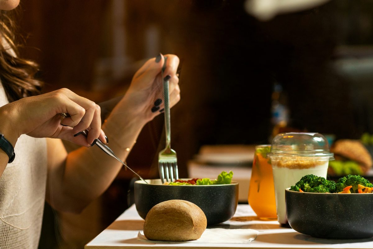 A nourishing meal of greens, protein and wholefoods at a table.