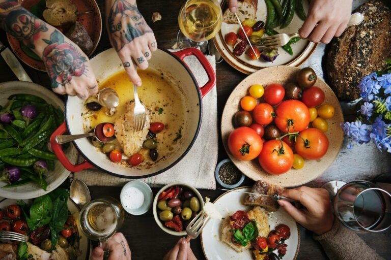 A colourful, generous meal laid out on a kitchen table.