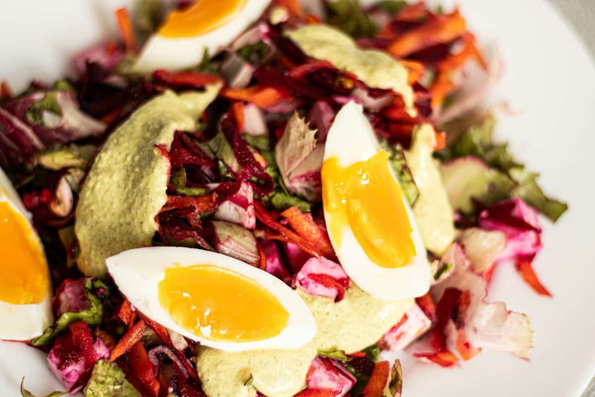 A fresh salad with boiled eggs and grated beetroot.